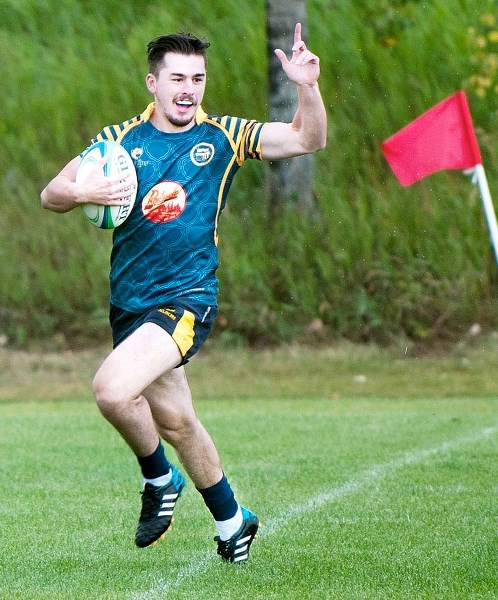 Bow Valley Grizzlies&#8217; Paul O&#8217;Grady skips across the line for a try in Calgary Rugby Union Second Division men&#8217;s play vs. Red Deer Titans on Aug. 15 at