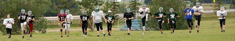 Springbank Community High School Phoenix take to the field Aug. 20 during the team&#8217;s football training camp session at the school field. Phoenix open the Rocky View