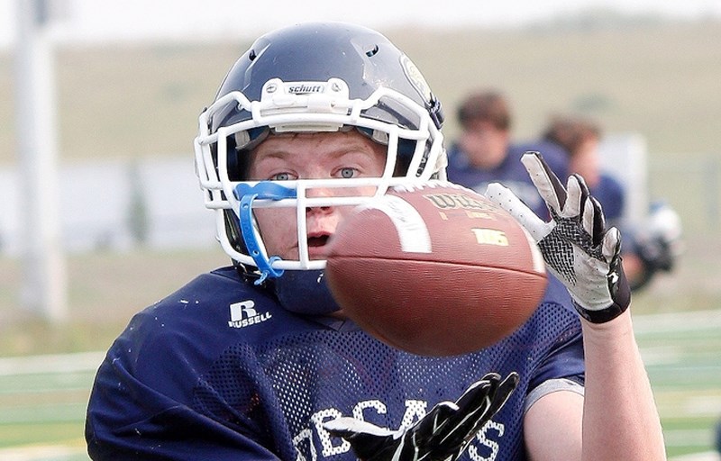 Rheese Mochar eyes a pass during Bow Valley High School Bobcats football training camp opening day Aug. 24 at Spray Lake Sawmills Legacy Field.