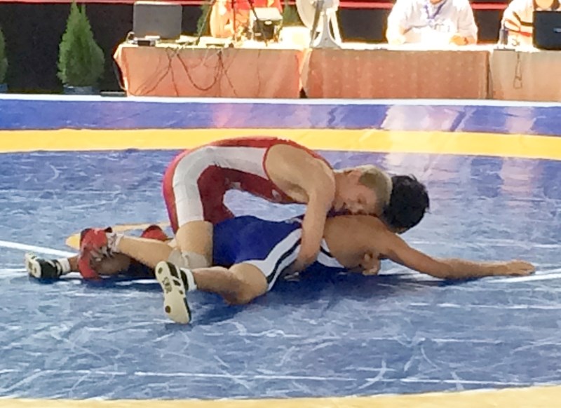 Cochrane Cowboys&#8217; Connor McNeice (top) wrestles Japan&#8217;s Jintaro Yamamoto in the 58-kilogram male class at World Cadet Wrestling Championships Aug. 29 in Sarajevo. 