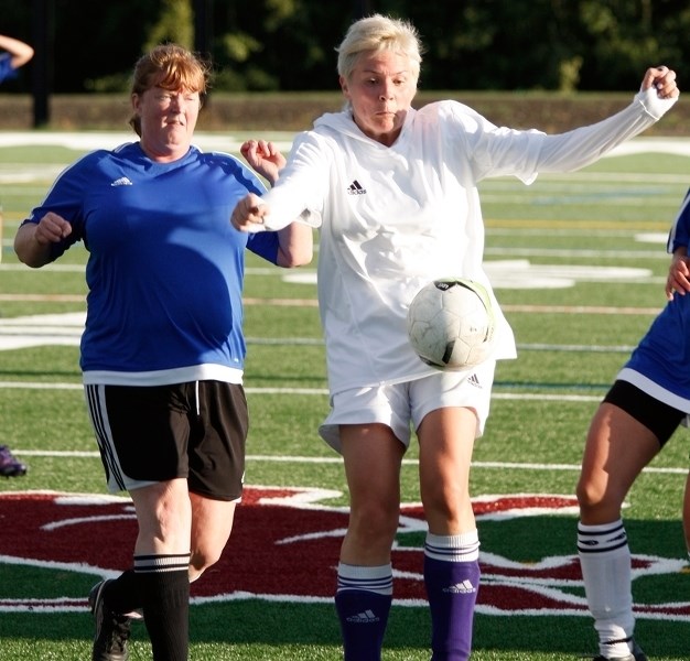 Cochrane Soccer Club&#8217;s Lana Ellard is first to the ball in Calgary Women&#8217;s Soccer Association play vs. visiting Pretenders II on Sept. 7 at Spray Lake Sawmills
