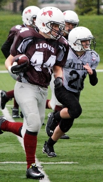 Cochrane Lions running back Jack Staddon runs to daylight before taking it to the house in Calgary Bantam Football Association play vs. Airdrie Raiders on Sept. 5 at