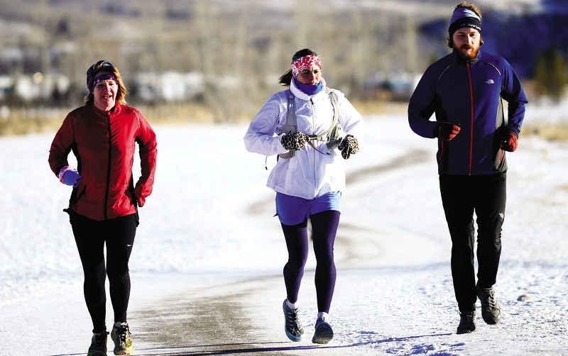 From left: Karen Johansen, Lourdes Kellam and Ian MacNairn partake in Martin Parnell&#8217;s New Year&#8217;s eve run.