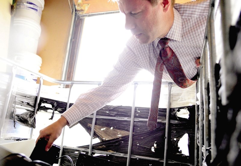 Holy Spirit Elementary School principal Greg Woitas shows off some of the tech junk being recycled by members of the public at the school Oct. 6.