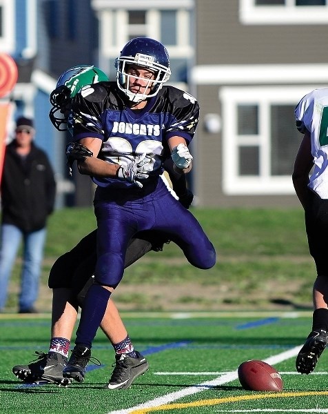 Bow Valley High School Bobcats Preston Kennerd blocks a pass attempt by the Springbank Phoenix on Oct. 13. Bobcats came away victorious in an 11-7 final.