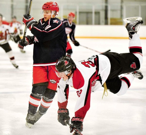 Generals forward Connor Rendell evades a Thrashers player as the Cochrane Generals defeated the Three Hills Thrashers 6-3 on October 24 at the Totem Arena in Heritage Junior