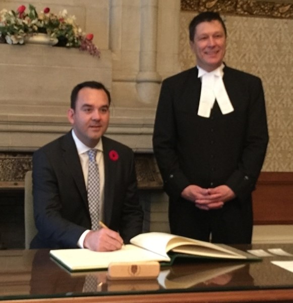 Banff-Airdrie Member of Parliament Blake Richards is sworn in at Ottawa.
