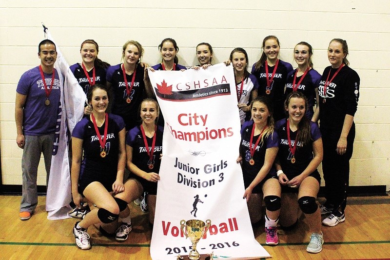 St. Timothy High School Thunder junior girl&#8217;s volleyball team displays the banner for defeating Calgary&#8217;s Crescent Heights Cowboys for the city title Nov. 13 in