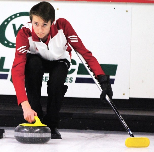 Junior curler Cole Adams displays his winning form at the first mixed doubles bonspiel held at Cochrane Curling Club Nov. 20-22. The North Hill Curling Club (Calgary) curler