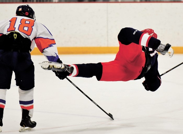 Generals forward Slater Ransom goes airborne in Heritage Junior Hockey League play vs. High River Flyers on Nov. 22 in Cochrane. Gens won 9-4.