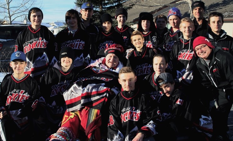 Cochrane Rockies Tier 3 bantam hockey team volunteered to hang the Bethany Care Christmas lights on the morning of Nov. 21. The team, pictured here with hockey fan George