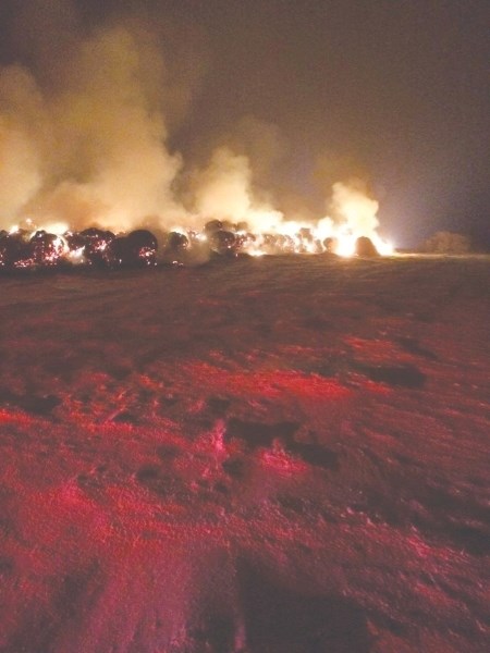 More than 200 hay bales burn Dec. 11 in Rocky View County southwest of Crossfield. Fire investigators are calling the cause of the blaze &#8216;suspicious.&#8217;