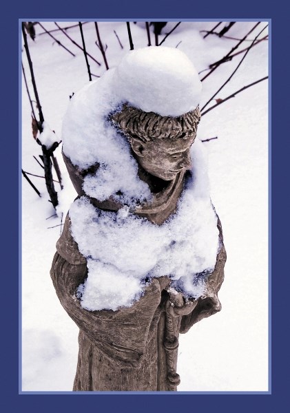 Snow-draped statue of St. Francis inspired thoughts of peace on earth.