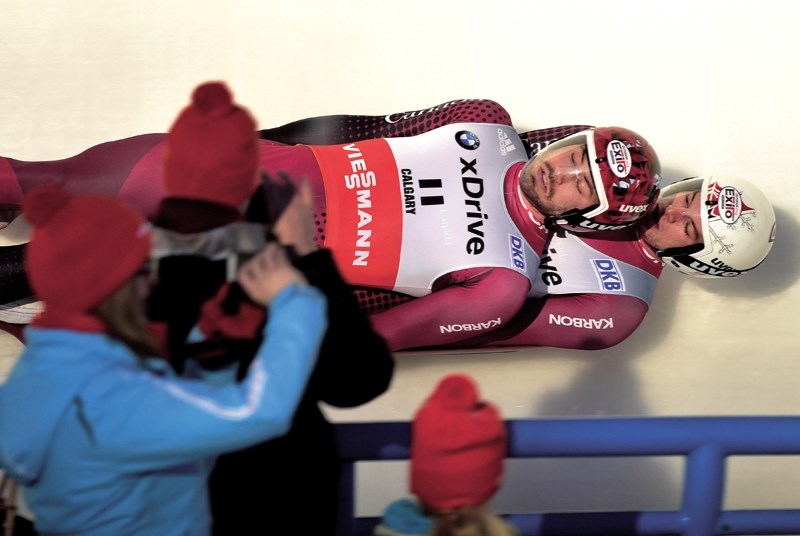 Cochrane&#8217;s Tristan Walker and Calgary&#8217;s Justin Snith fly down the WinSport luge track during the Dec. 19 BMW Sprint World Cup luge event in Calgary.
