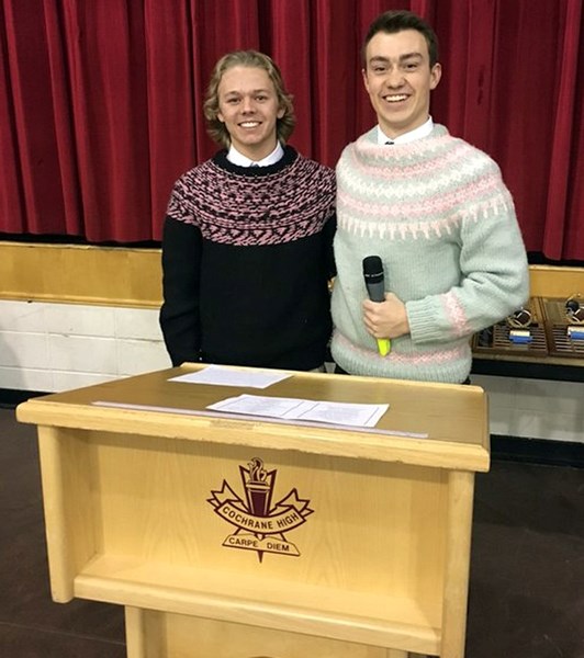 Cochrane High School Cobras football players Spencer Marchand (left) and Evan Perrault prepare to emcee the team&#8217;s football awards proceedings Dec. 17 in the school gym.