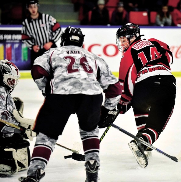 CFR Bisons&#8217; Kyle Gordon of Cochrane flips a backhand shot on net during Mac&#8217;s Midget Hockey Tournament play vs. Ontario (Calif.) Avalanche Dec. 27 in Calgary.