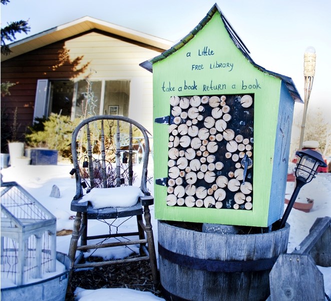 Alanna Thompson&#8217;s Little Free Library at 42 Benchlands Drive in Cochrane invites readers to come and share a book.