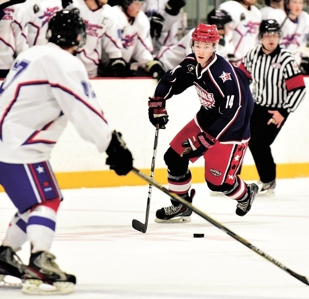 Gens defenceman Logan Brown skates the puck into the offensive zone on the power-play as the Cochrane Generals went on to lose 5-4 in overtime to the Mountain View Colts on