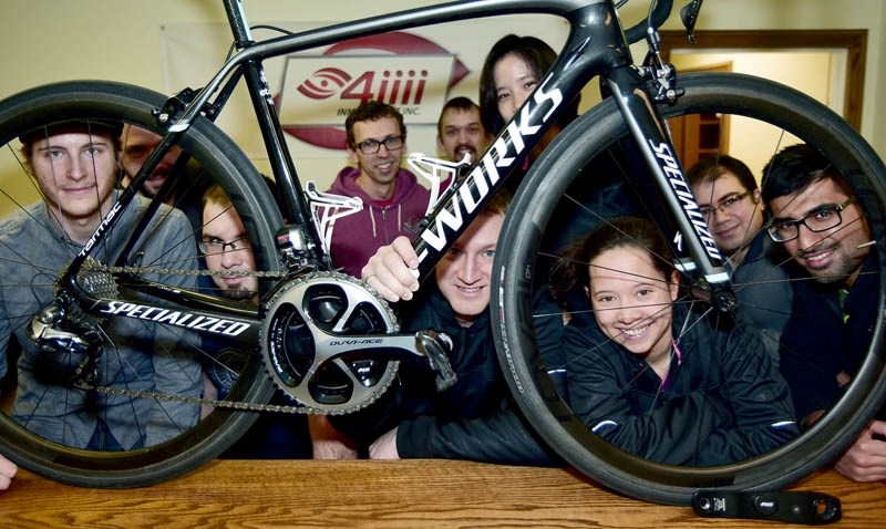 The team from 4iiii Innovations Inc. in Cochrane display some of their tech which will be taking a trip to the Tour de France.