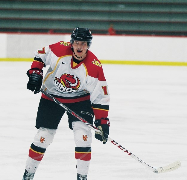 Cochranite and University of Calgary Dinos rookie forward Coda Gordon tracks back into his team&#8217;s defensive zone during their 3-1 win over the Mount Royal Cougars in