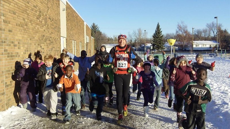 Martin Parnell runs with students at West Dover Elementary School in Calgary.