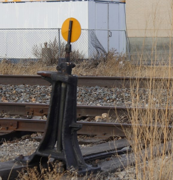 Gaps in the fence along the train tracks in Cochrane concern Kari Murphy, who lost son Lamont to a mishap on the train tracks in town six months ago.