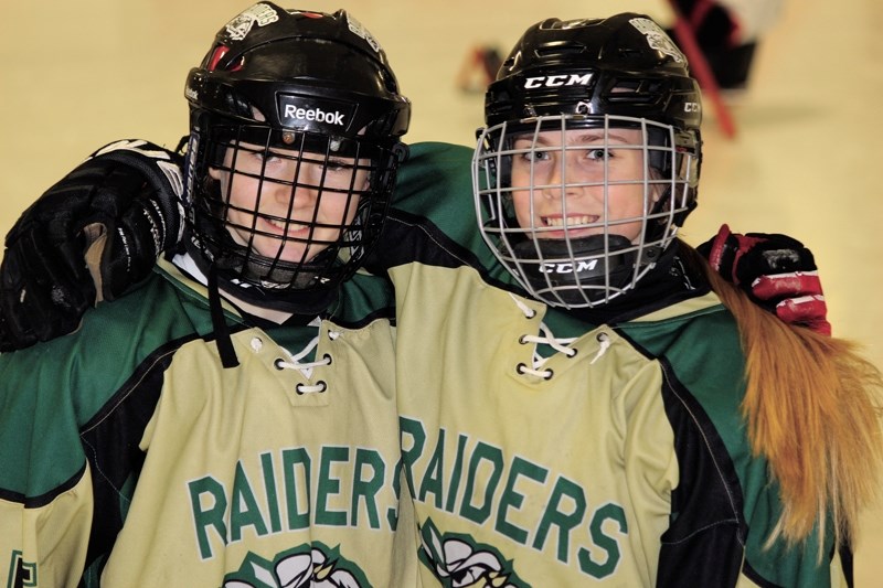 Cochranites Sarah Wozniewicz (left) and Jessica Martens (right) of the Bantam AAA Rocky Mountain Raiders have been selected to the Zone 2 female hockey team for the Alberta