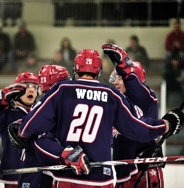 Cochrane Generals forward Colton Wong celebrates scoring his second goal of the game with teammates in their 7-2 playoff win over Strathmore Wheatland Kings on Feb. 16. The