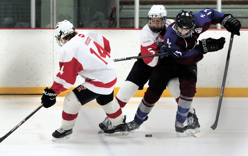 Avs forward Ben Davison (#13) avoids the clutches of an NWCAA Stampeders player during his team&#8217;s 5-1 win on Feb. 13.