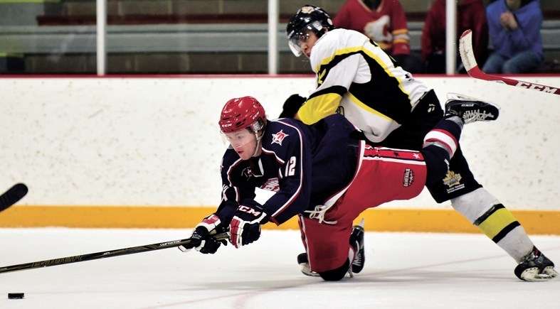 Gens forward George King gets checked from behind during his team&#8217;s series against Strathmore Wheatland Kings. Gens swept Kings 4-0 in the series, outscoring them 25-8