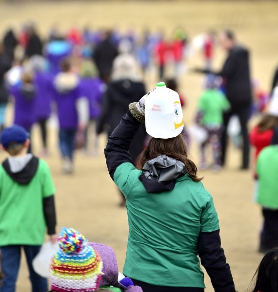 Students and teachers from Elizabeth Barrett Elementary School walked laps around the school with jugs full of water at their sides and on top of their heads March 22 as they 