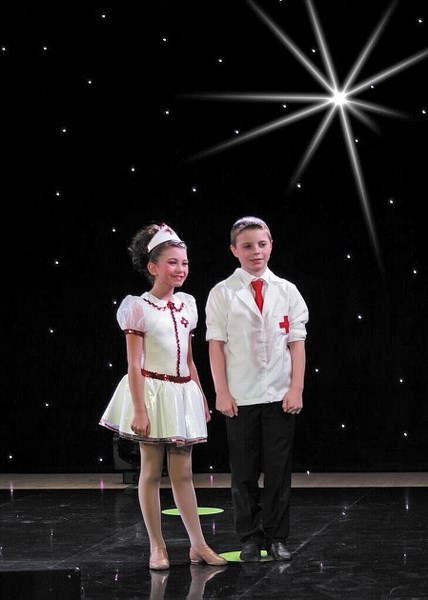 Willow Fluker, left, and Brett Fisher are on stage at the GALALA talent TV show production filmed in Airdrie in February. The series kicks off in April and their dance duet