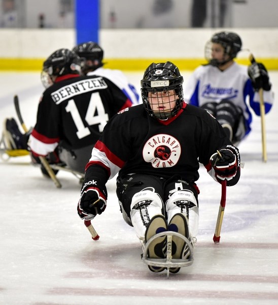 Fourteen-year-old Cochranite and Calgary Venom sledge hockey player Eric Carvelli surveys the action during his team&#8217;s 7-3 loss to the Regina Avengers on March 26 at