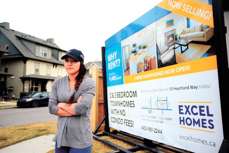 Maddie Beynon isn&#8217;t too impressed with Excel Homes after a gust of wind swept the companies marketing sign and carried it across the street onto Beynon&#8217;s vehicle