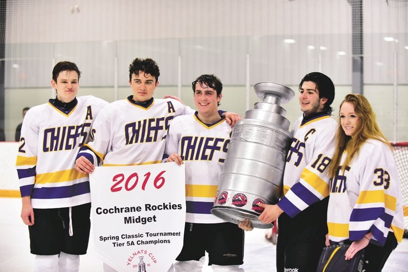 (Left to right): Riley Brassington, Mikael Scott, Craig deleMare, Alexander Singeris, and Haileigh Gofton of the Cochrane Chiefs pose with the Yelnats Cup. Chiefs took down