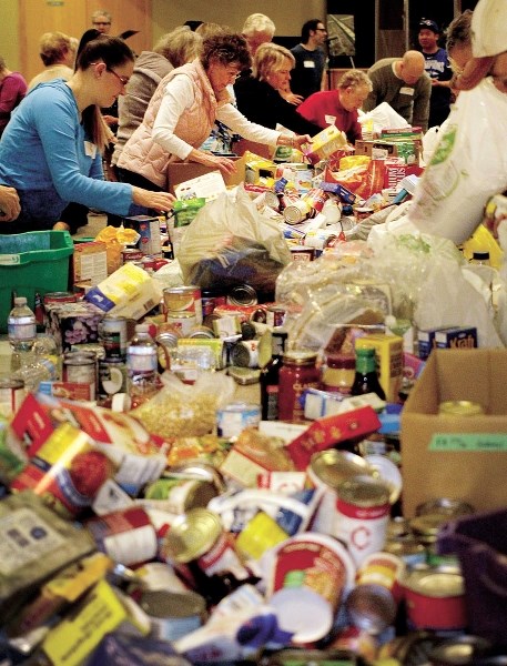 The Cochrane community opened its doors and donated thousands of food items this year for the Helping Hands Society of Cochrane and Area&#8217;s food drive.