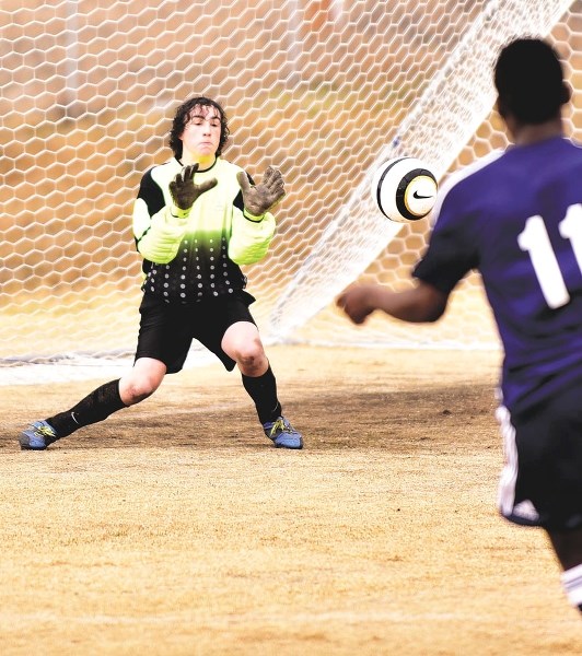 St. Timothy Thunder goalie Ethan Hobbes blocks a shot during his team&#8217;s 7-1 home defeat to John Diefenbaker High School on April 14. The game marked the opening of the