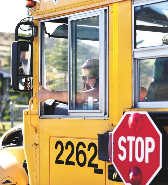 Bus driver Janelle Byrne, who drives the Mitford Tri-Schools 202 route, shows her enthusiasm for her job on May 3.