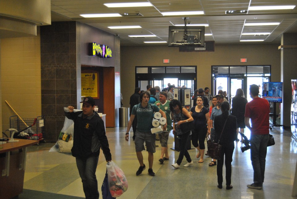 Evacuees arrive at Bold Center in Lac La Biche.