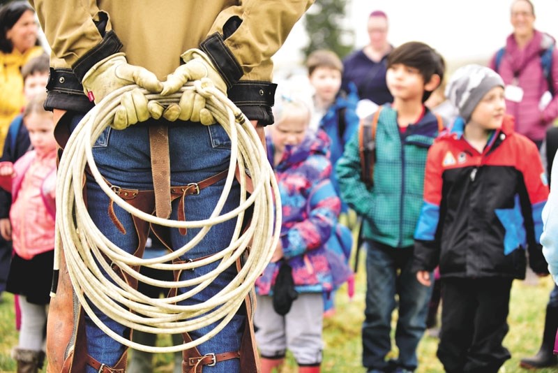 Wineglass Ranch owner Travis Eklund speaks to a group of kindergarten kids. Students from Elizabeth Barrett Elementary School learnt a thing or two about farming on April 27