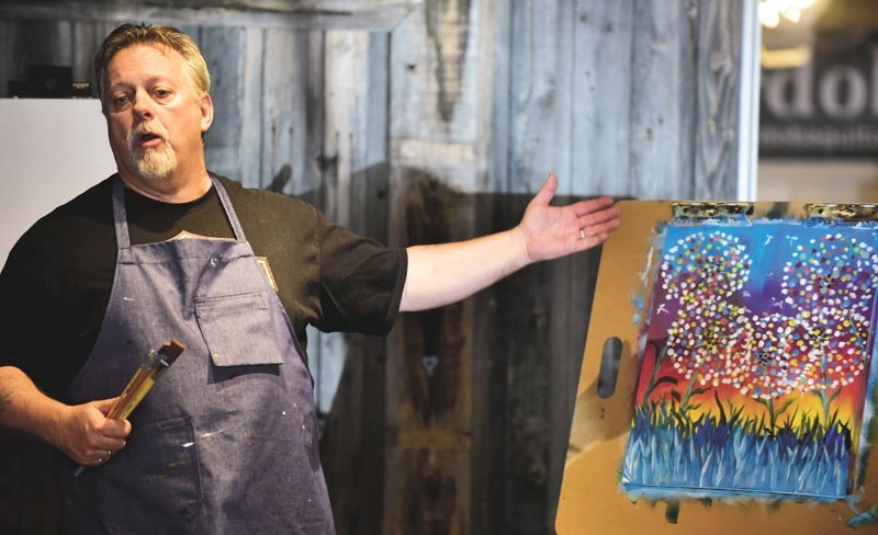 Roy Eckmeier, of Paint for Fun Cochrane teaches a class. Paint a Memory raised $1,470 for a bench in the memory of Lamont Murphy.