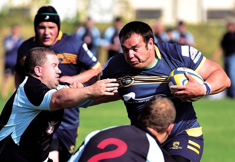 Anthony Battistone of the Bow Valley Grizzlies rugby charges up the field.