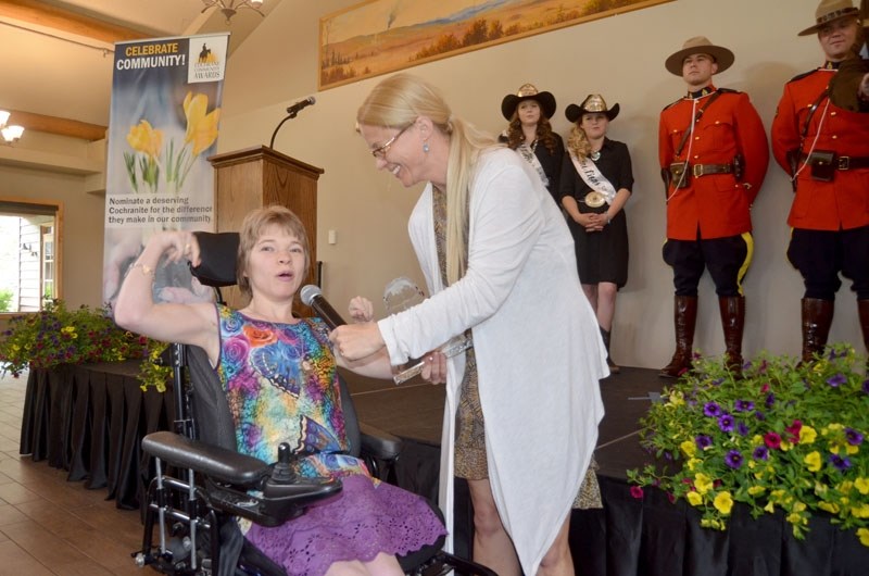 Elisa Neven-Pugh receives the town&#8217;s inaugural Equity and Inclusion Champion of the Year winner, which recognized her efforts to help make Cochrane more accessible for