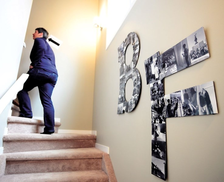 A member of the public walks through a house built by high school students as part of the Building Futures Program.