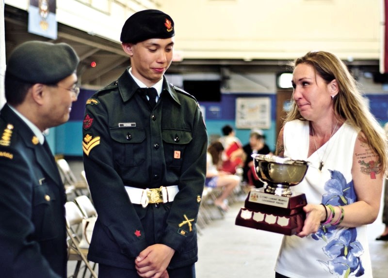 Kari Murphy present cadet master Cpl. Jonathan Wong (with Capt. Johnny Mo, far left) with the new C/CWO Lamont Murphy Leadership Award, in honour of her son Lamont who died