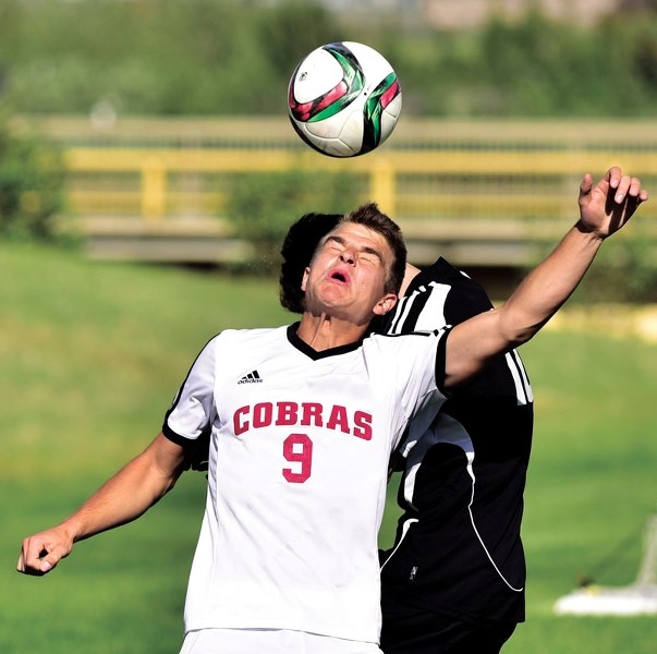 Cochrane Cobras player Adam Zuczek goes up for a header during his team&#8217;s 3-2 divisional semi-final loss to the George McDougall Mustangs on June 2 at Rangers Field.