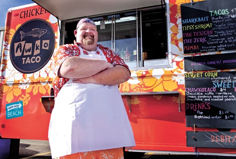 Brian Gebbie, owner/operator of Awko Taco stands proudly in front of Cochrane&#8217;s newest food truck that launched earlier this month.