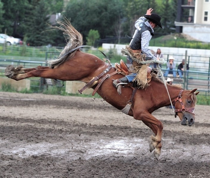 Sundre cowboy Daniel Gratton during his 68 point ride on Dibbs at the fifth annual Foothills Bucking Horse Futurity on July 14 at the Cochrane Lions Rodeo Grounds.