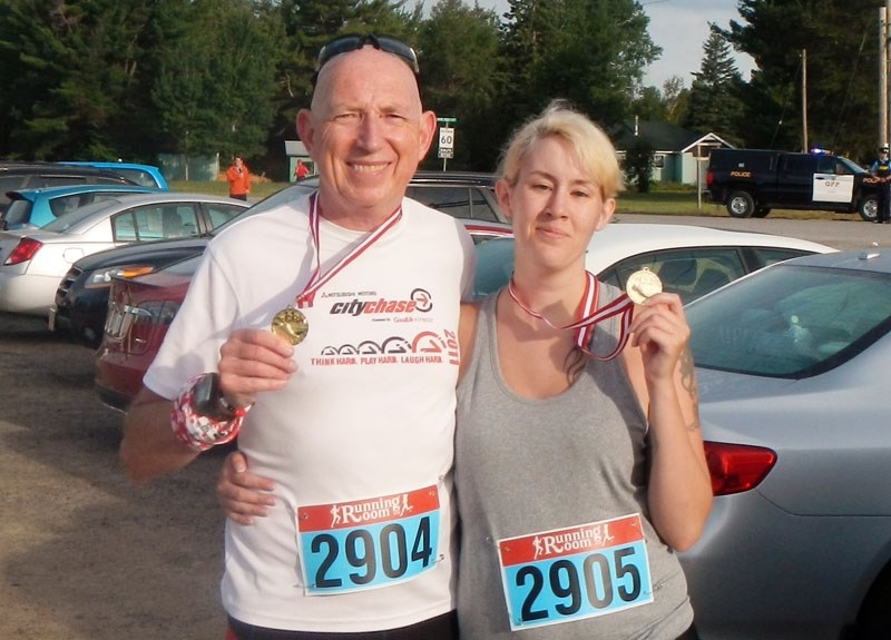 Daughter Kristina successfully completes her first five-kilometre race and catches a “;Weedle”at the finish line.