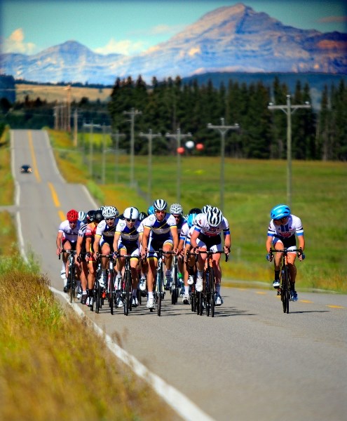Riders work their way down Horse Creek Road to the finish line at Wheedon Community Hall during stage one (road race) of the 15th annual Tour de Bowness on July 30.